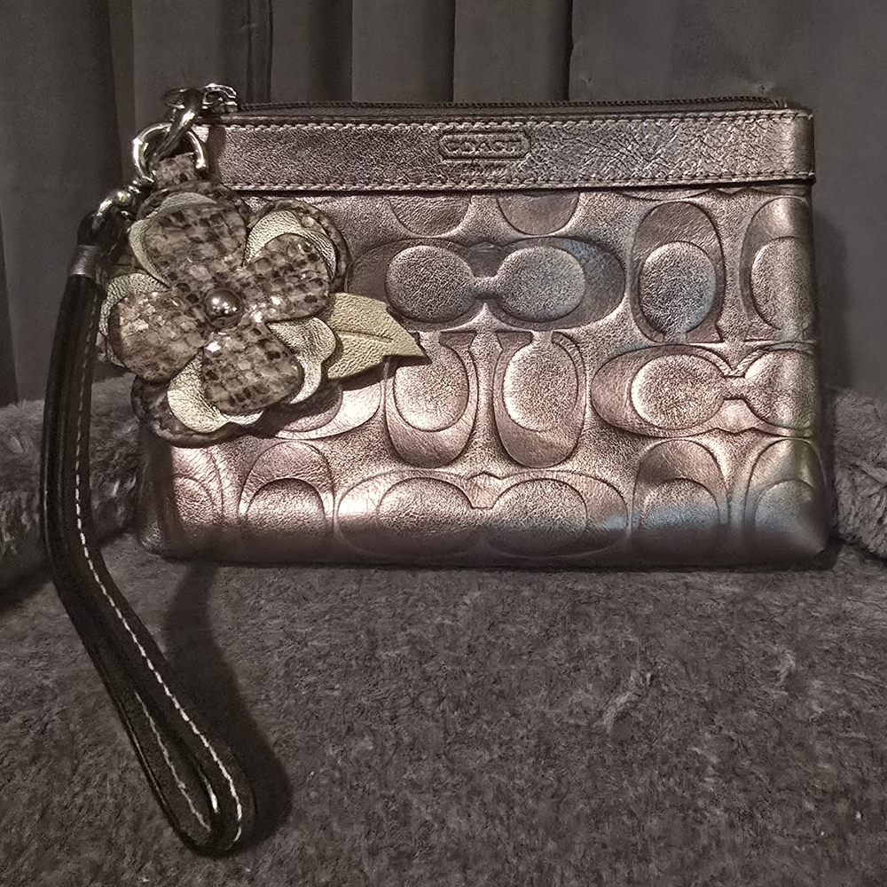 Coach Bronze Leather Wristlet with Floral Accent